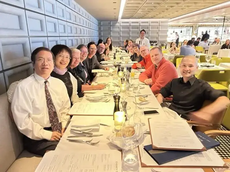 Discover Church partners at a formal fellowship dinner aboard a cruise ship restaurant during a ministry tour