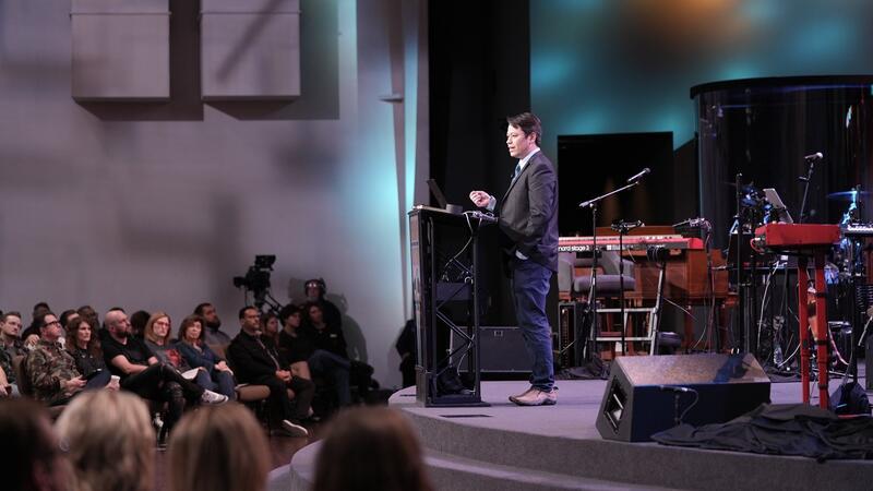 Pastor Steve Cioccolanti teaching from the pulpit at Discover Church